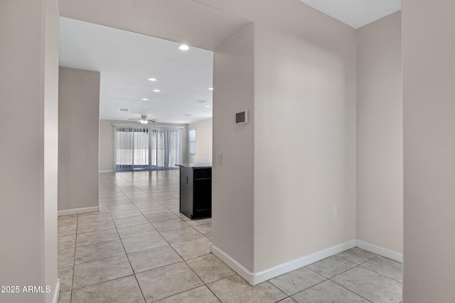 29402 W Mitchell Ave, Buckeye, AZ 85396 - hall featuring light tile patterned floors, baseboards, and recessed lighting