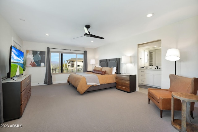 bedroom featuring ceiling fan, connected bathroom, and carpet flooring