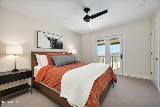 carpeted bedroom with access to exterior, ceiling fan, and french doors