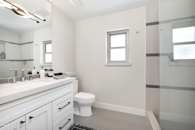 bathroom with tile flooring, toilet, and oversized vanity