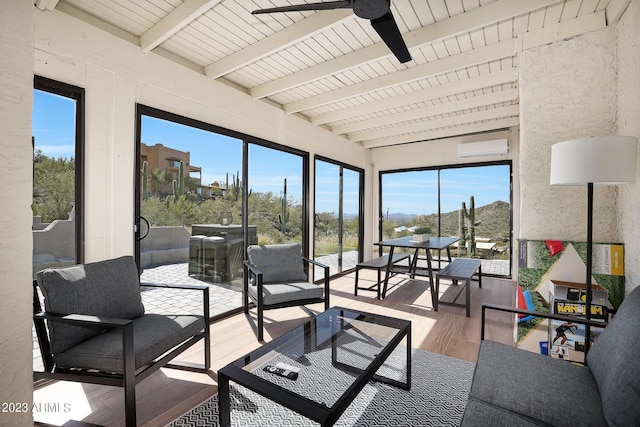 sunroom / solarium with ceiling fan, beamed ceiling, an AC wall unit, and plenty of natural light