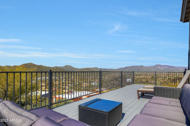 deck with a mountain view and outdoor lounge area