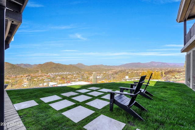 view of yard with a mountain view and a patio