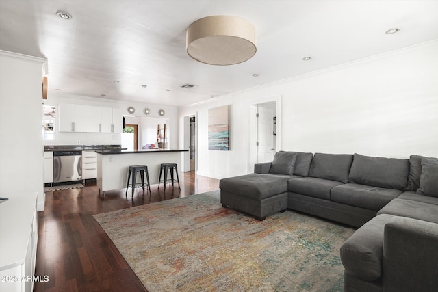 living room with recessed lighting, visible vents, crown molding, and dark wood-type flooring