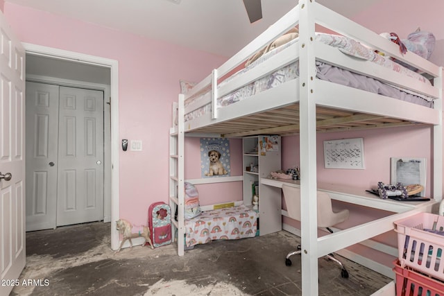 bedroom featuring concrete flooring