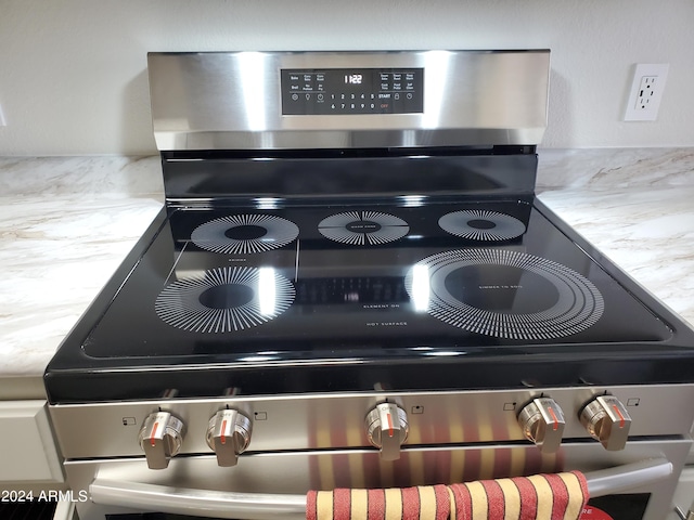 interior details featuring stainless steel electric range