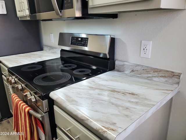 kitchen with stainless steel appliances and wood-type flooring