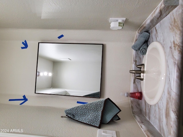 interior space featuring a textured ceiling