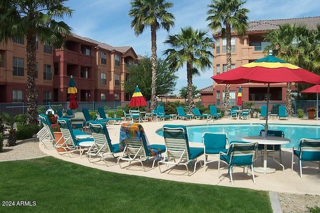 view of swimming pool with a patio area