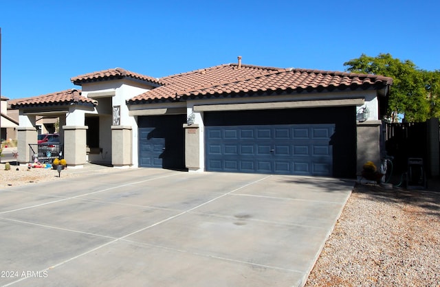 mediterranean / spanish-style house featuring a garage