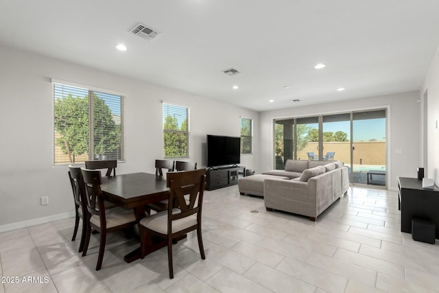 dining room featuring baseboards, visible vents, and recessed lighting