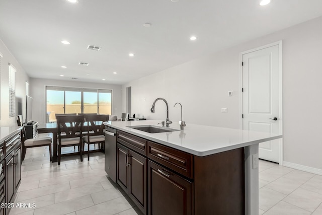 kitchen featuring light countertops, a sink, visible vents, and recessed lighting