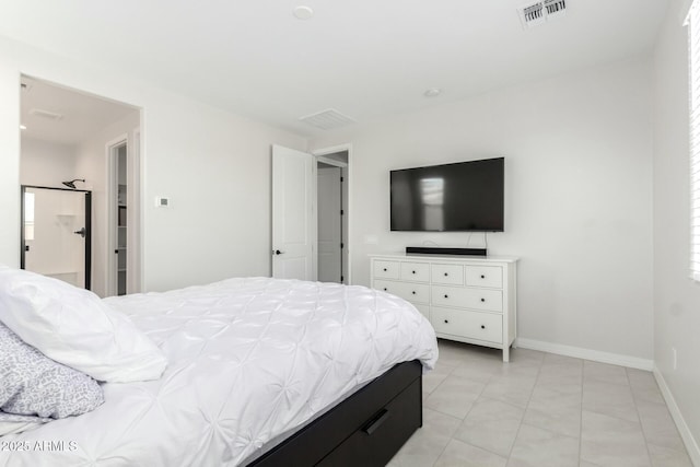 bedroom with visible vents and baseboards