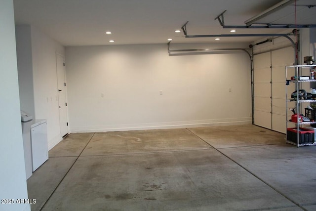 garage with baseboards and recessed lighting