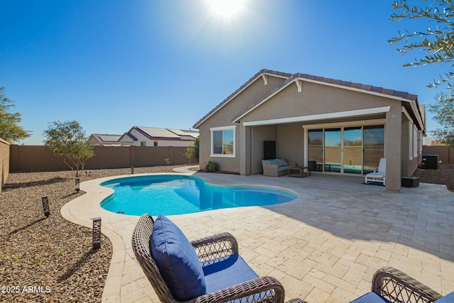 view of swimming pool featuring a patio area, a fenced backyard, and a fenced in pool