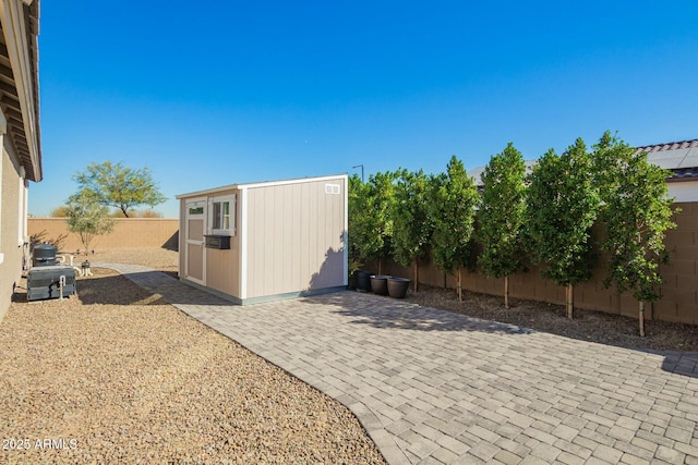 view of shed featuring a fenced backyard