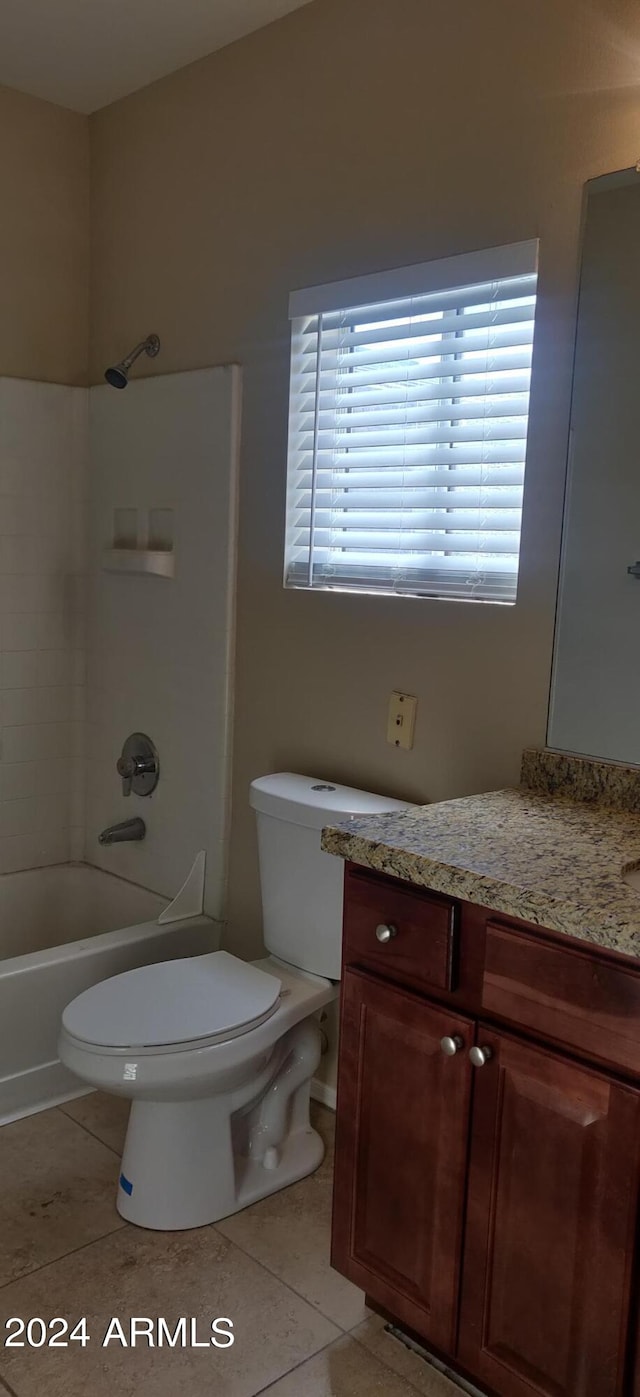 full bathroom featuring vanity, toilet, tile patterned floors, and shower / bath combination