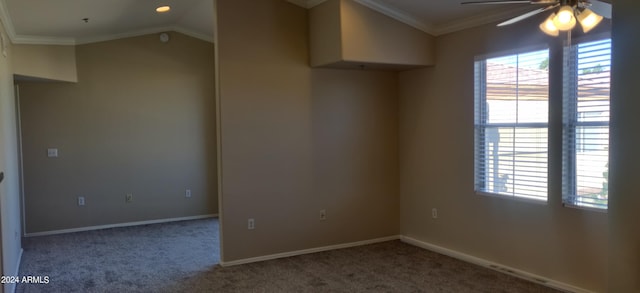 carpeted spare room with ornamental molding, lofted ceiling, and ceiling fan