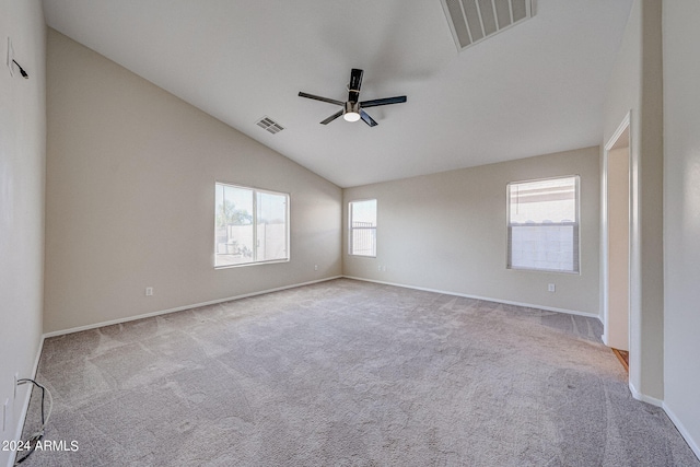 carpeted empty room featuring lofted ceiling and ceiling fan