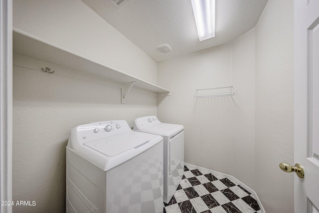 laundry room with washing machine and dryer