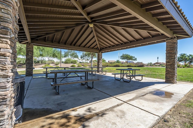 view of community featuring a gazebo, a yard, and a patio