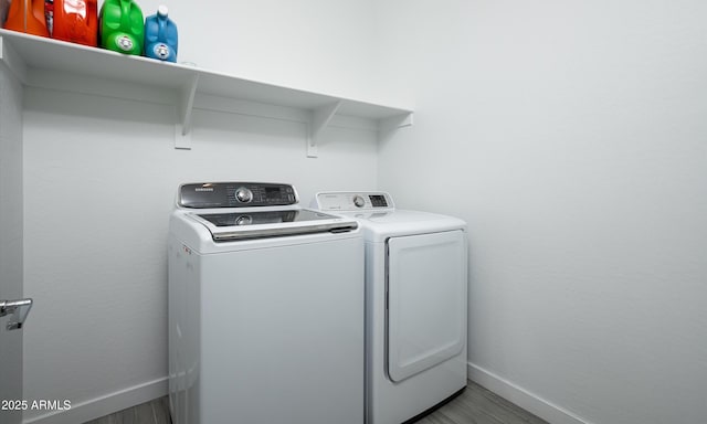 laundry room with washing machine and clothes dryer