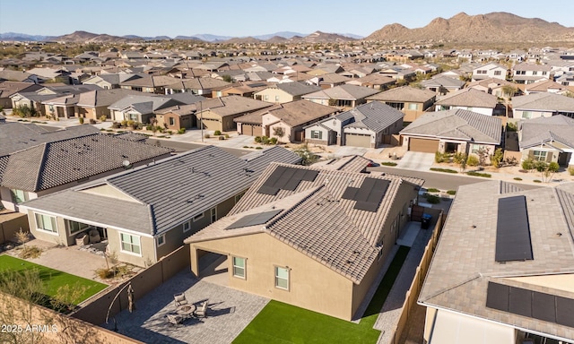 birds eye view of property with a mountain view