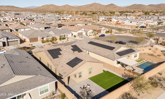 birds eye view of property with a mountain view