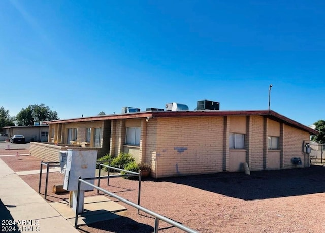 single story home with central air condition unit