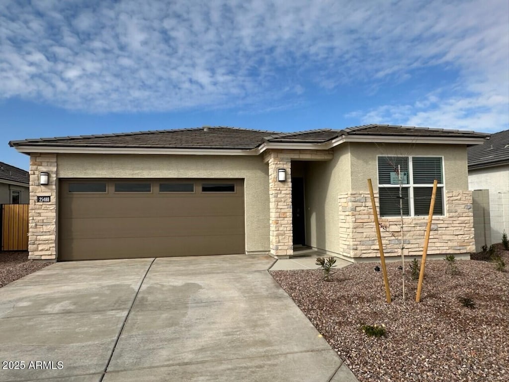 prairie-style home featuring a garage