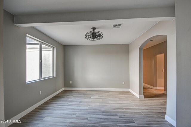 unfurnished room featuring light wood-type flooring