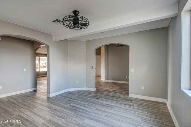 unfurnished room featuring ceiling fan