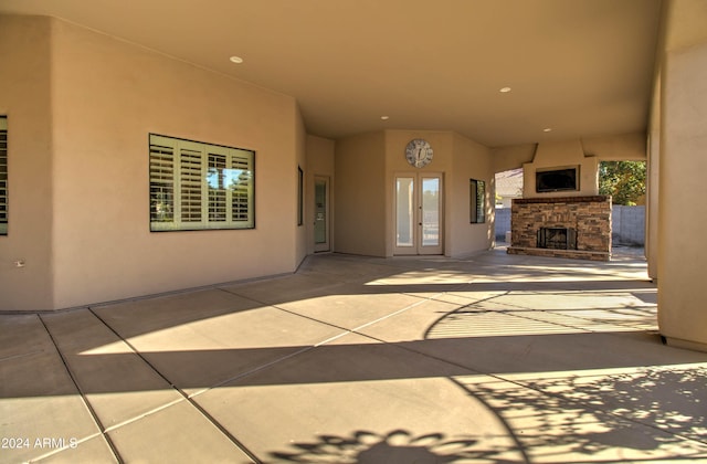 view of patio featuring an outdoor stone fireplace