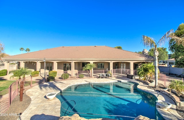 view of swimming pool with a patio