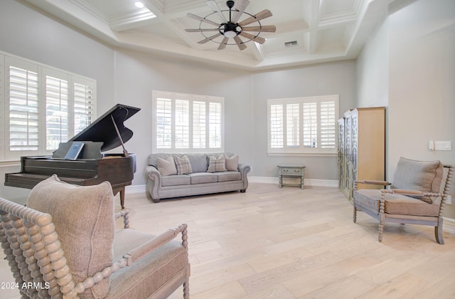 living area with ornamental molding, light hardwood / wood-style flooring, beam ceiling, and coffered ceiling