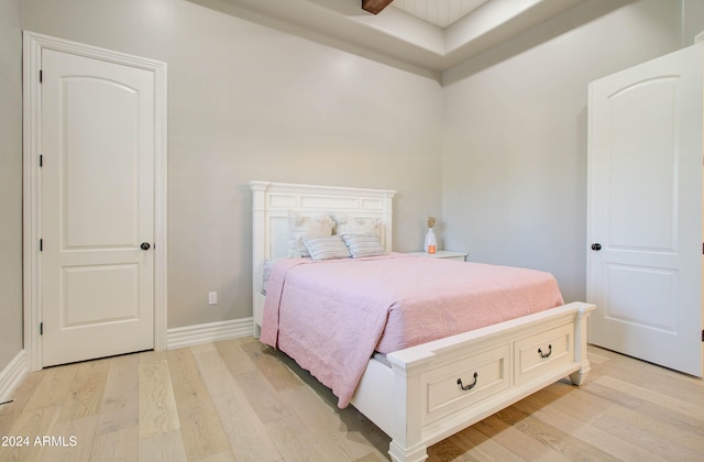 bedroom with ceiling fan and light hardwood / wood-style floors