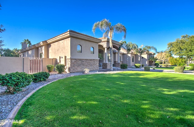 view of front of home with a front lawn