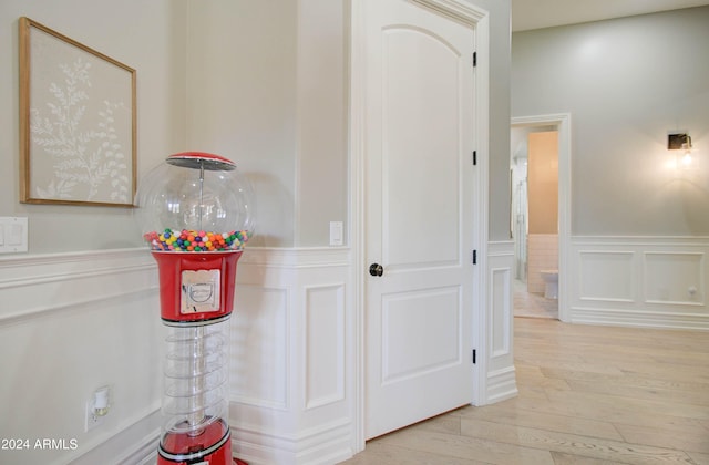 corridor with light hardwood / wood-style flooring