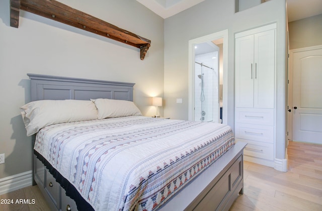 bedroom featuring a closet and light hardwood / wood-style flooring