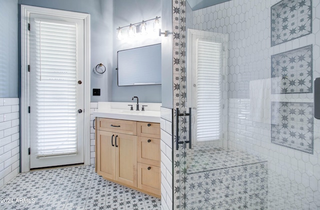 bathroom featuring tile walls and vanity