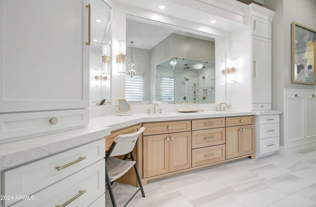 bathroom with vanity and an enclosed shower