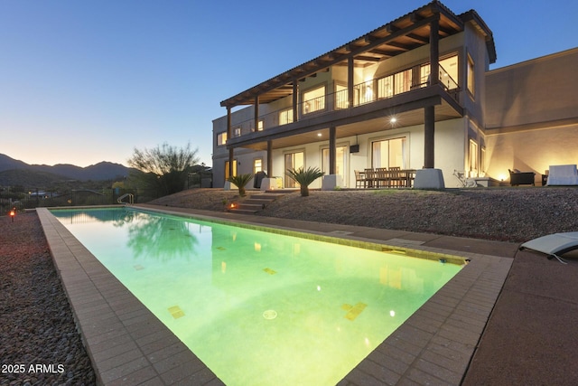 pool with a mountain view and a patio