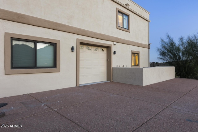 exterior space with fence and stucco siding