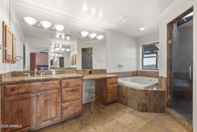 bathroom featuring visible vents, a stall shower, vanity, ensuite bath, and a bath