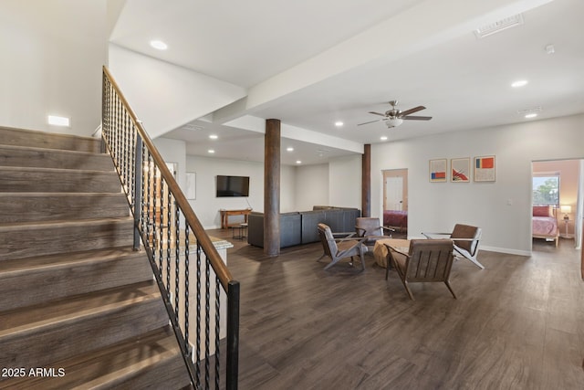 living room featuring recessed lighting, visible vents, dark wood finished floors, and stairs