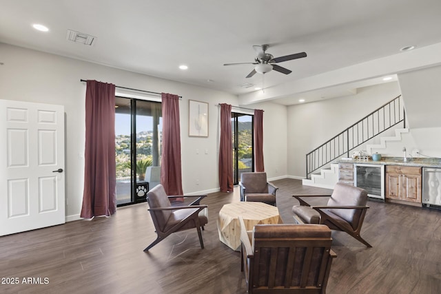 interior space with wine cooler, stairway, dark wood finished floors, and baseboards