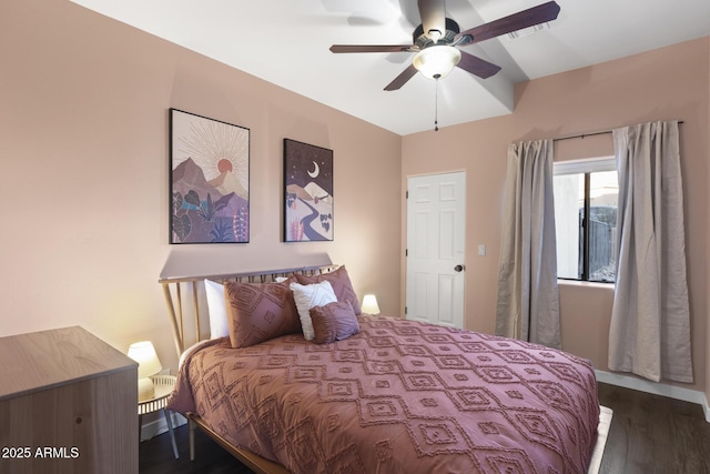 bedroom featuring dark wood-style floors and a ceiling fan