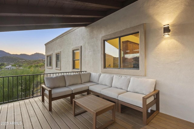 wooden deck featuring outdoor lounge area and a mountain view