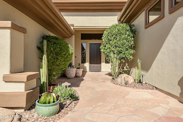 property entrance with a patio