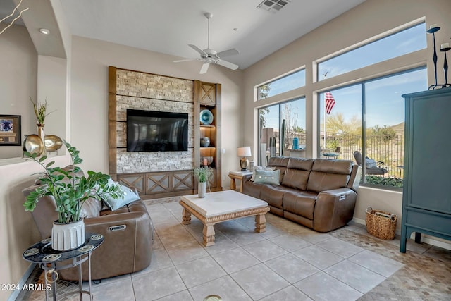 tiled living room featuring ceiling fan